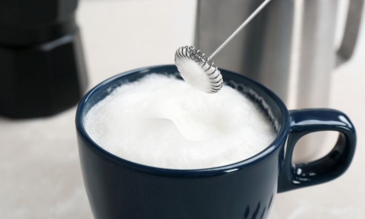 foaming milk with handheld frother