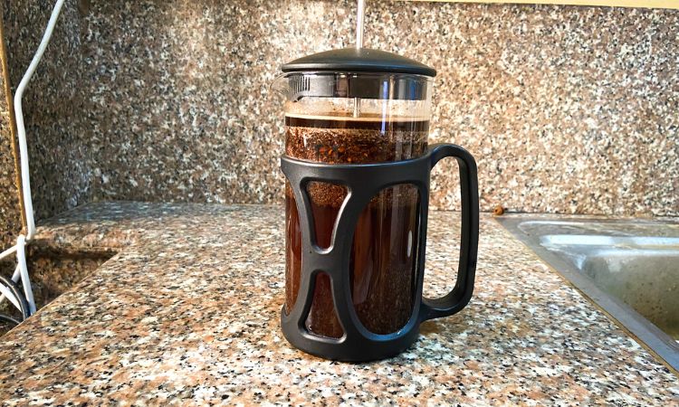 French Press with Coffee Grounds and Water